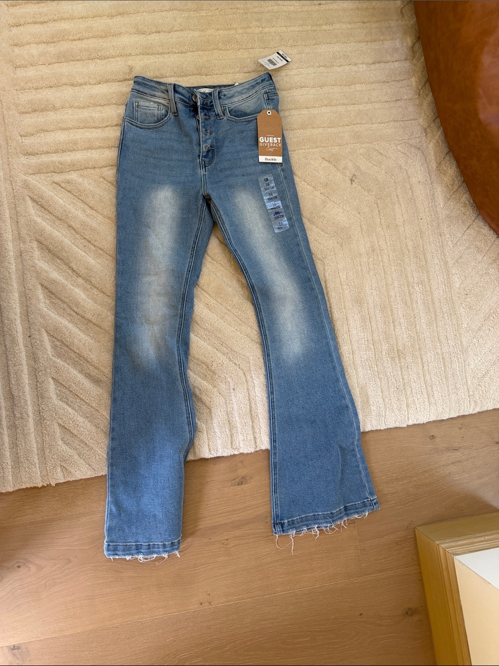 Buckle Light Blue Flare Jeans with Faded Knees